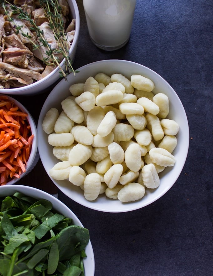 a bowl of potato gnocchi and spinach