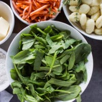 a bowl of fresh spinach ready to go in the soup