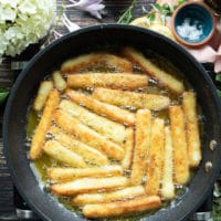 halloumi cheese frying and bubbling in a pan