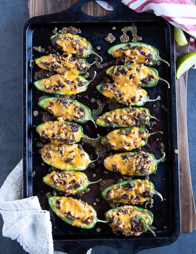 Baked jalapeno poppers recipe out of the oven with the cheese melted ontop
