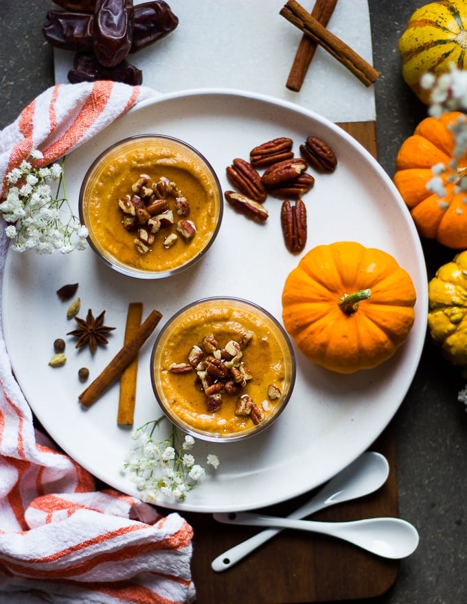 pumpkin pudding topped with roasted nuts.