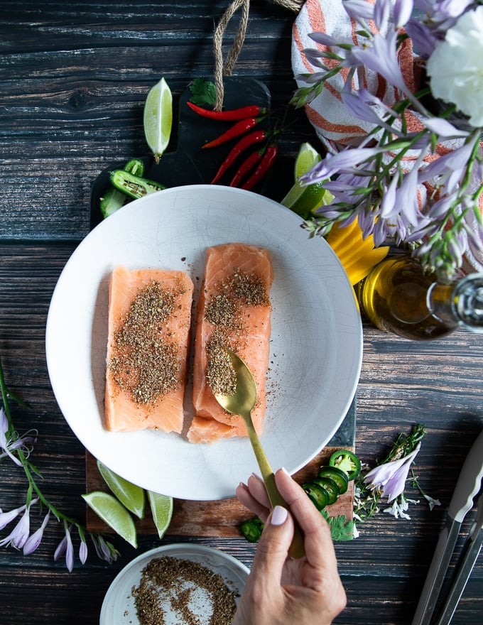 spice blend over the salmon fillets to season