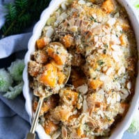 a serving spoon scooping out butternut squash casserole