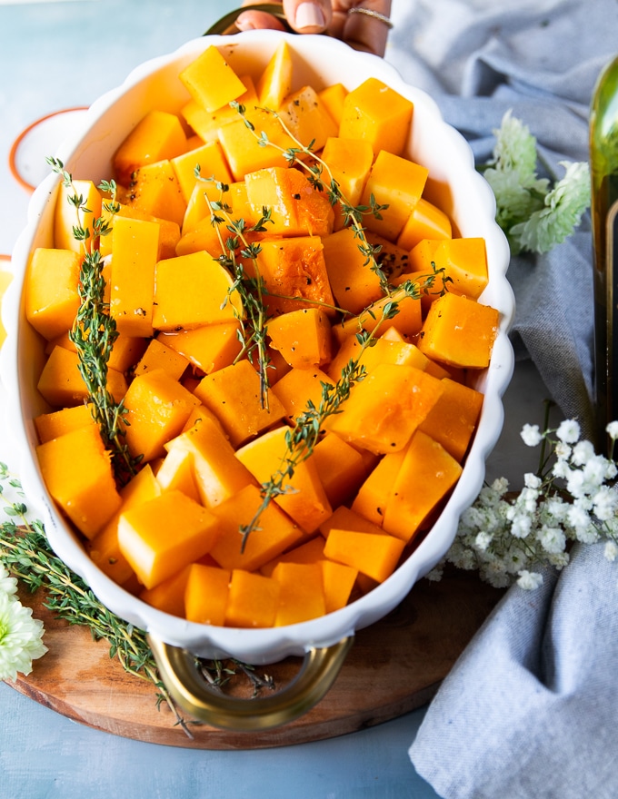 seasoned and ready to roast butternut squash in a casserole dish