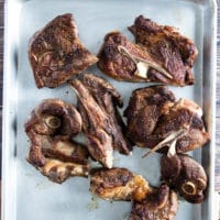 All the lamb shoulder chops seared and ready on a baking sheet