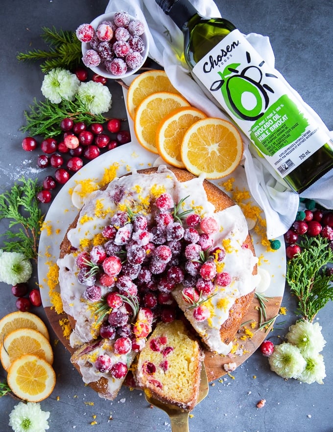 sliced orange cake with cranberries showing the texture of the cake