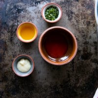 Ingredients for the sweet buffalo sauce including : hot sauce, garlic paste, honey and parsley