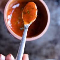 A spoon showing off the finished buffalo sauce
