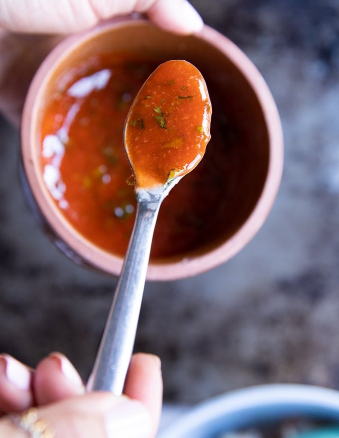 A spoon showing off the finished buffalo sauce
