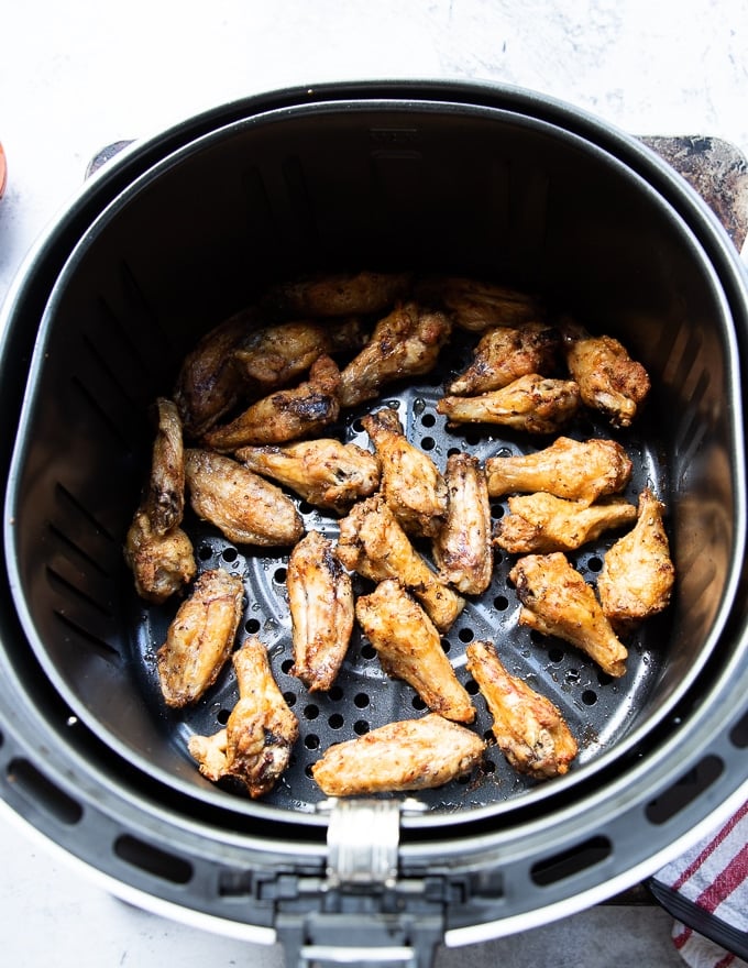 Flipping chicken wings half way through air frying