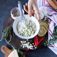 All ingredients of the homemade blue cheese dressing in a bowl