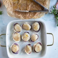 seasoned scallops on the baking shell on a cooking sheet