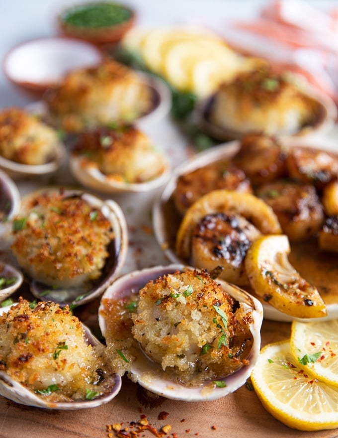close up of baked scallops in their shells cooked out of the oven and golden 