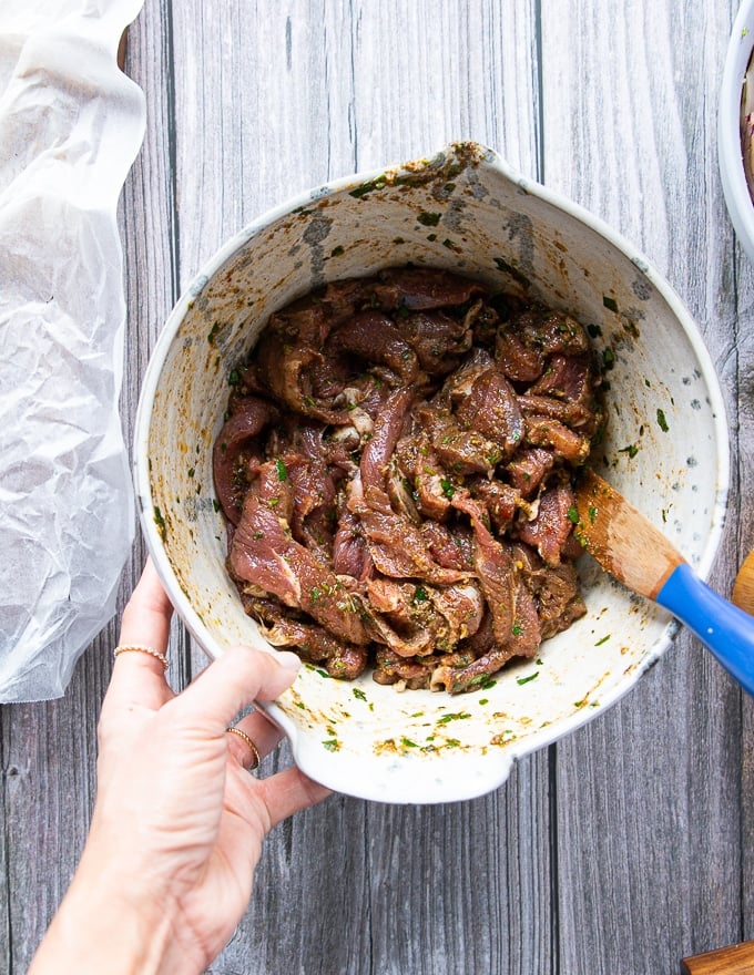 the fajita meat added to the bowl of marinade and tossed well to coat