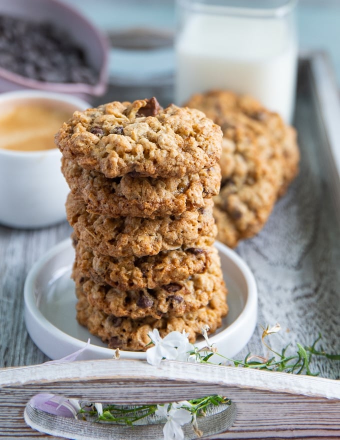 A stack of oatmeal cookies on a white plate close up