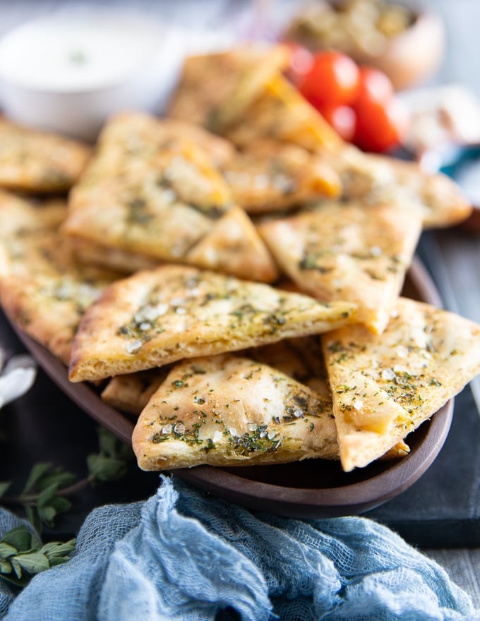 side view close up of a single pita chips showing the crisp