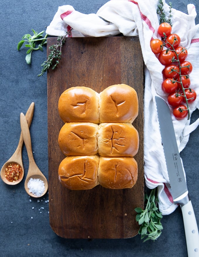 a board with the buns used for pizza rolls