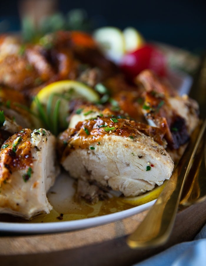 close up of the chicken breast cut up to show how juicy the air fryer whole chicken is on the inside