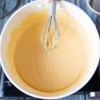 cheese whisked into the nacho cheese sauce until smooth and creamy