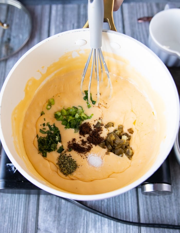 A combination of spices and flavoring added over the pot to flavor the nacho cheese sauce recipe which is optional