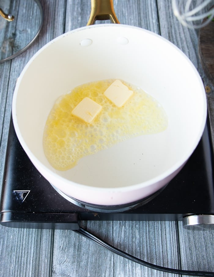 butter melting in a pot to make the nacho cheese sauce