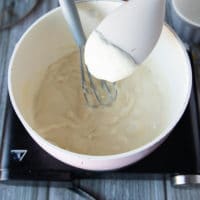 A spatula showing the final consistency of the rouch with. the milk boiled and the flour thickened