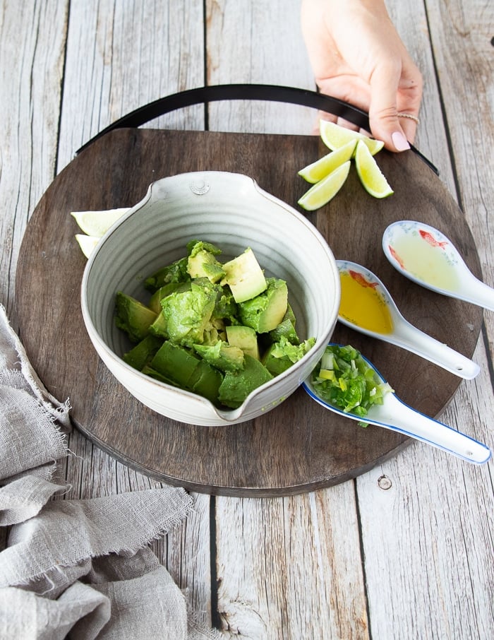 avocado layer ingredients including diced avocado, scallions, lime juice, oil