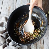 A large bowl with the asian marinade ingredients all mixed in