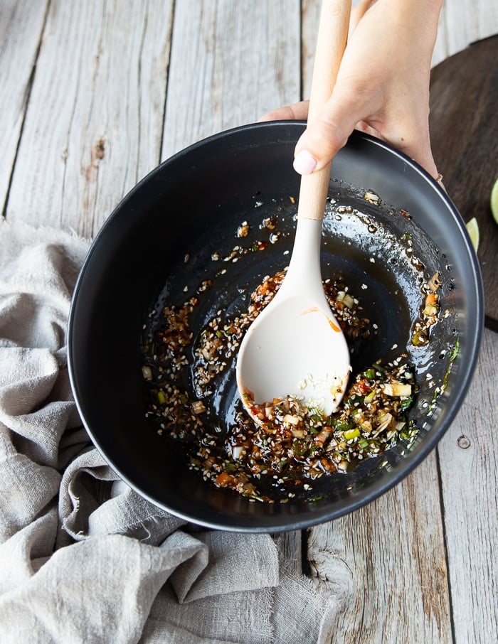 A large bowl with the asian marinade ingredients all mixed in