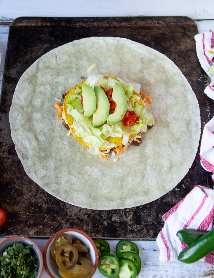 fresh chopped tomatoes and avocados added over the lettuce 