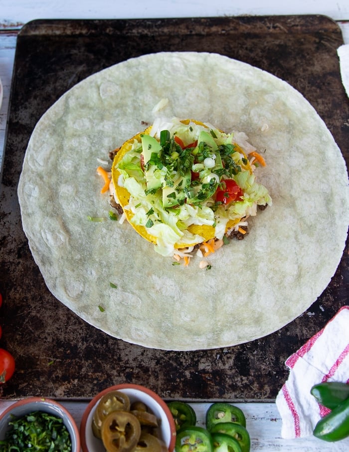 Jalapeños and cilantro added over the avocado tomato layer