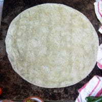 steps to making crunchwrap supreme starting with a large size tortilla at the bottom