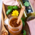 top down view of sun dried tomato pesto in a jar.