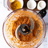 mixing sun dried tomato pesto in a food processor