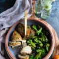 Cut up air fryer chicken breasts facing up and showing the juicy chicken piece on a fork