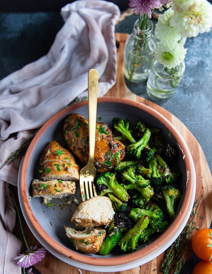 Cut up air fryer chicken breasts facing up and showing the juicy chicken piece on a fork