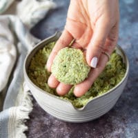 A hand shaping up the falafel mix into a round falafel shape ready to fry it