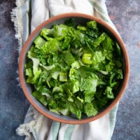 Salad added to the bowl