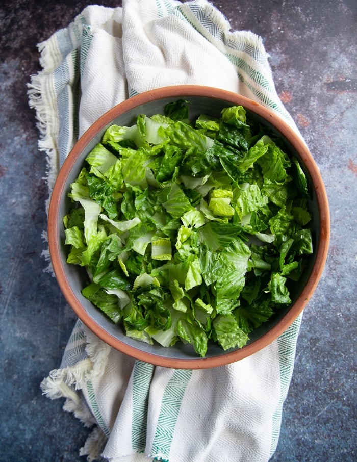 lettuce added to the bowl