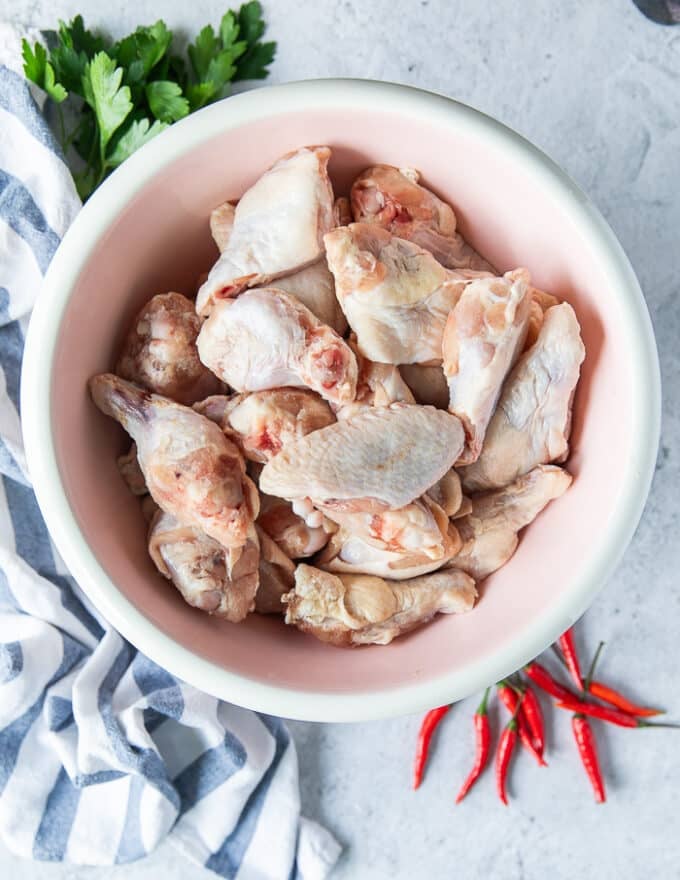 Cleaned and trimmed chicken wings in a bowl