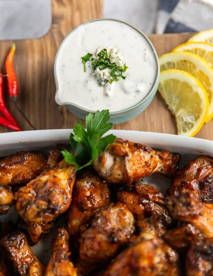 The blue cheese sauce served on the side of the ready chicken wings