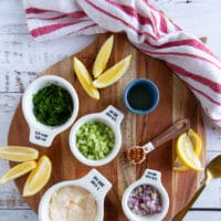 ingredients for lobster roll including mayo, celery, parsley, lemon juice, onions, chilli flakes