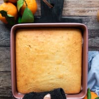 The mandarin orange cake right out of the oven, golden brown and baked