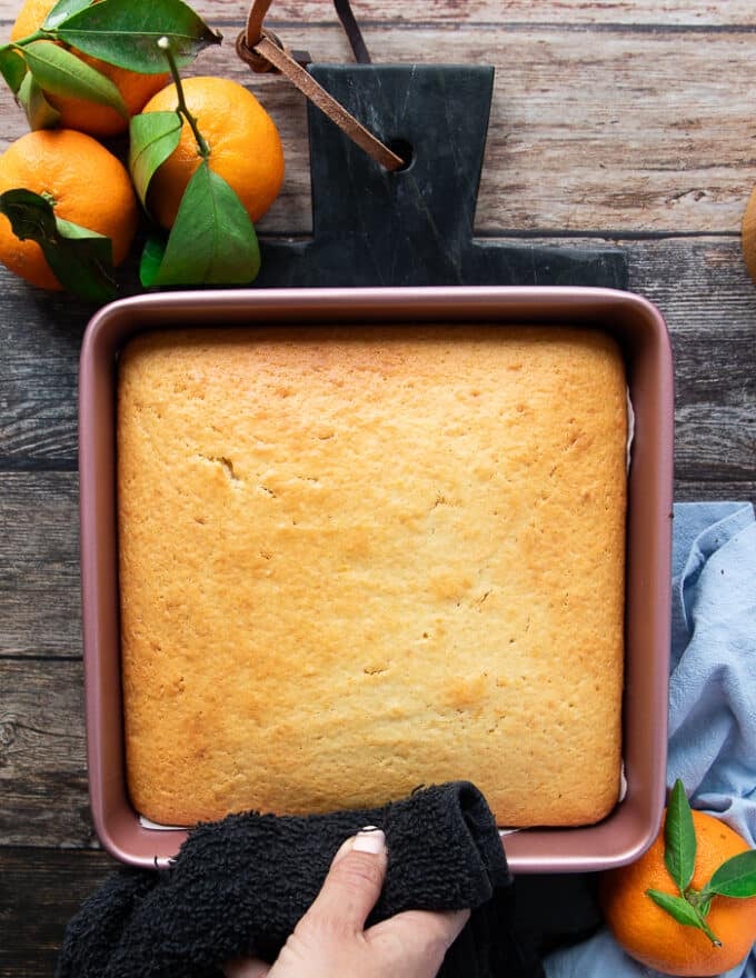 The mandarin orange cake right out of the oven, golden brown and baked