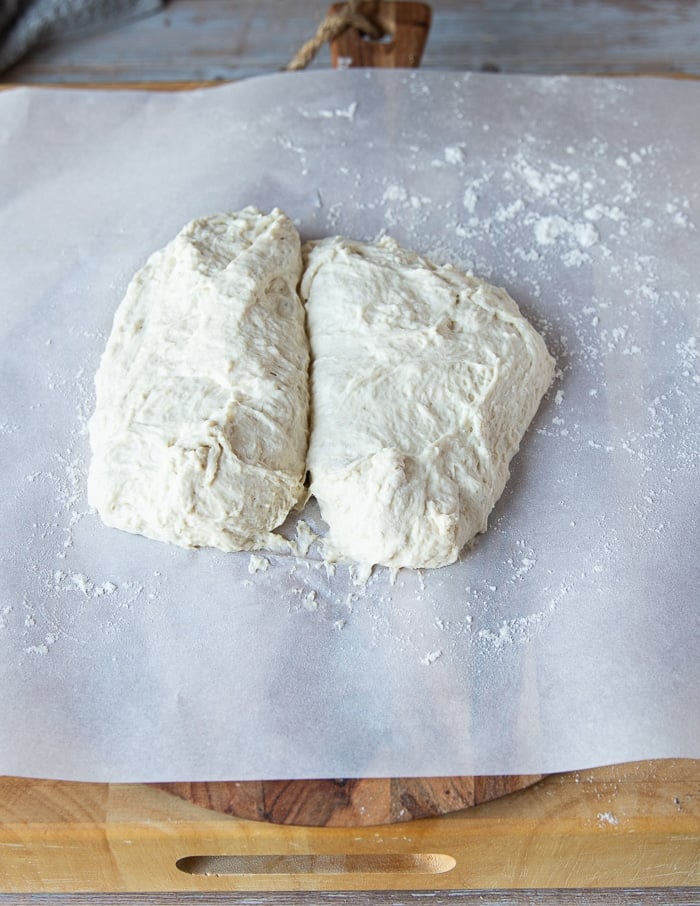 Divided No Knead Pizza Dough on a silicone mat.