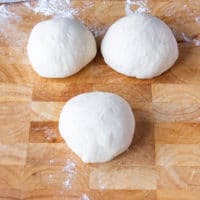 dough is divided into three equal amounts.