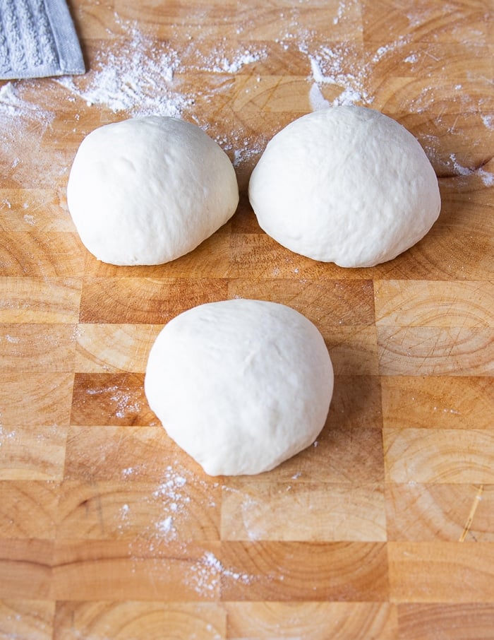 dough is divided into three equal amounts.