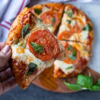 close-up of small homemade Margherita pizza.