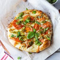 Top-down view of a whole Caprese pizza.