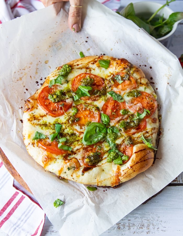 Top-down view of a whole Caprese pizza.